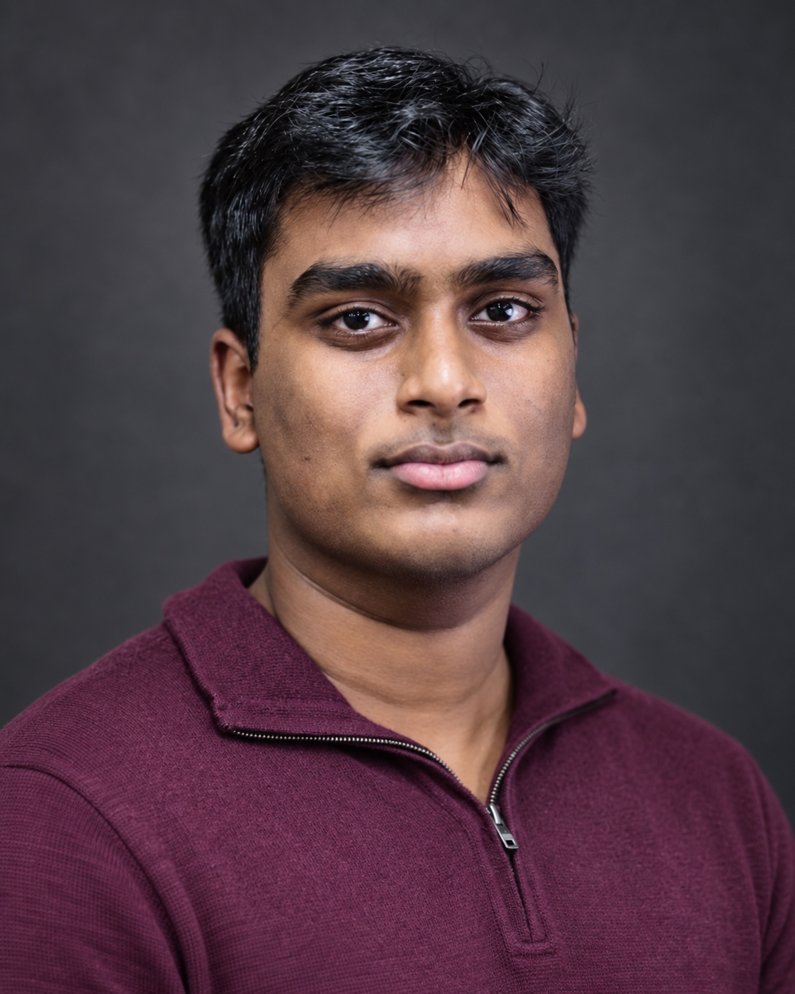 Venkata Teja Kalluri in a burgundy polo